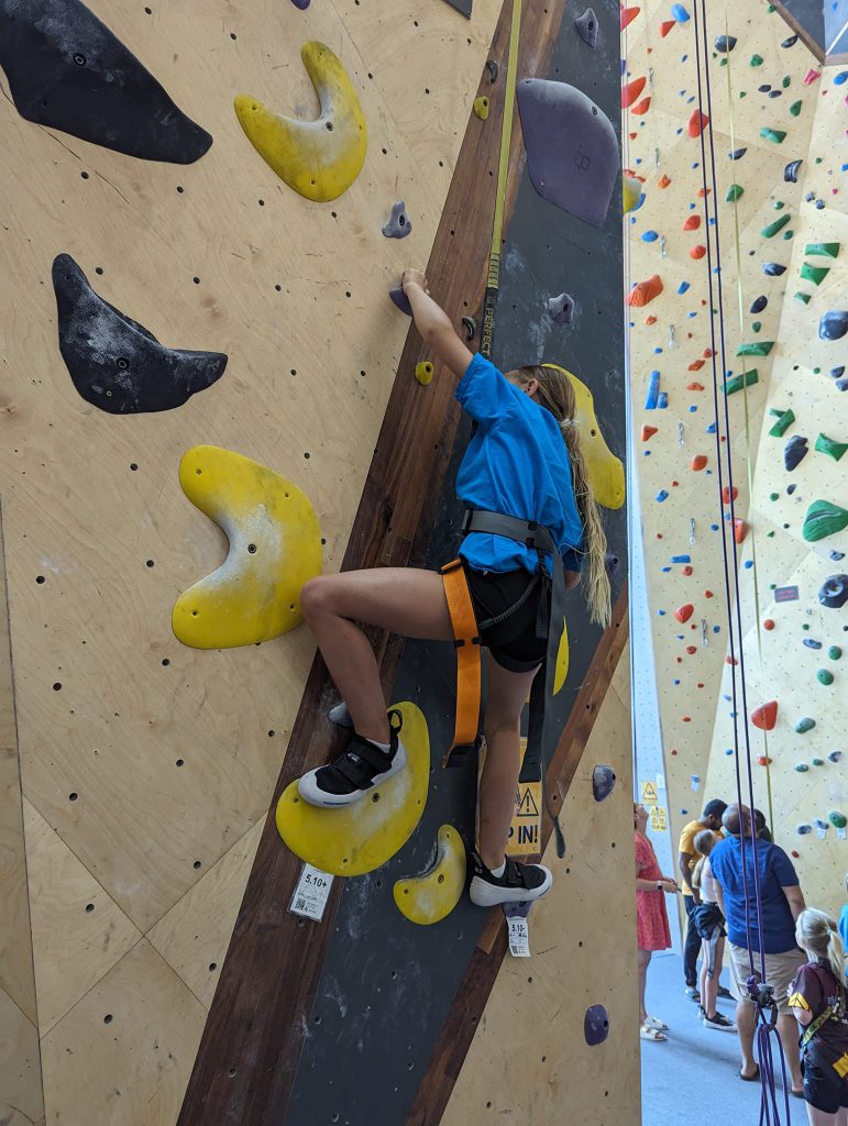 girl indoor rock climbing